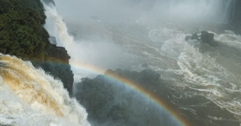 Rainbow Salad - A rainbow is seen over a waterfall