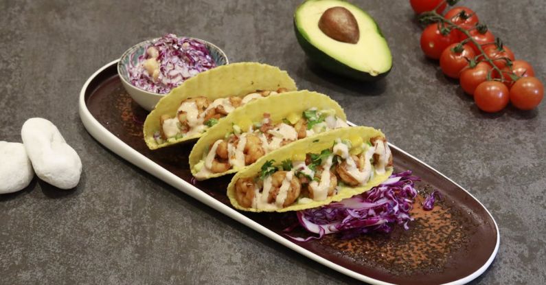 Taco Salad - Creamy Prawns and Salad on Taco Shells on a Ceramic Tray