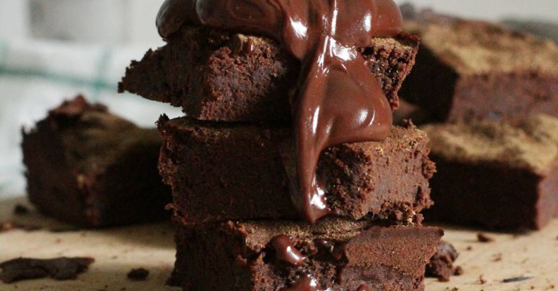 Brownies - Close-Up Photo Of Stacked Brownies On Chopping Board