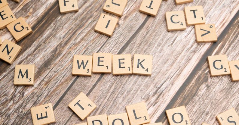 Weeknights - Scrabble letters spelling the word week on a wooden table