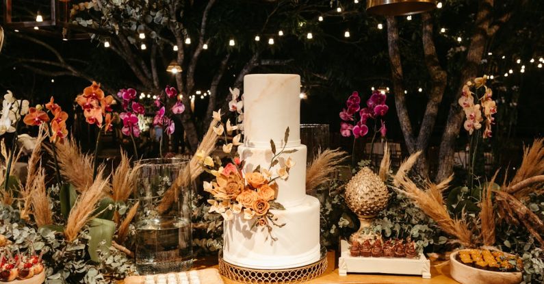 Layer Cake - Layer Cake and Flower Decorations on a Table at a Party