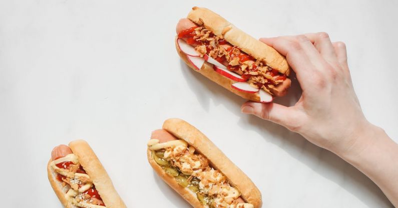 Fourth Of July - Person Holding Hotdog Sandwiches