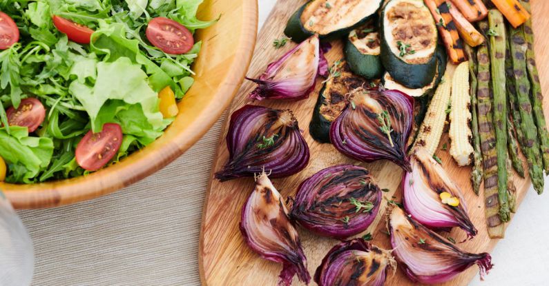 Grilled Vegetables - Salad in Bowl Next to Grilled Vegetables on Table