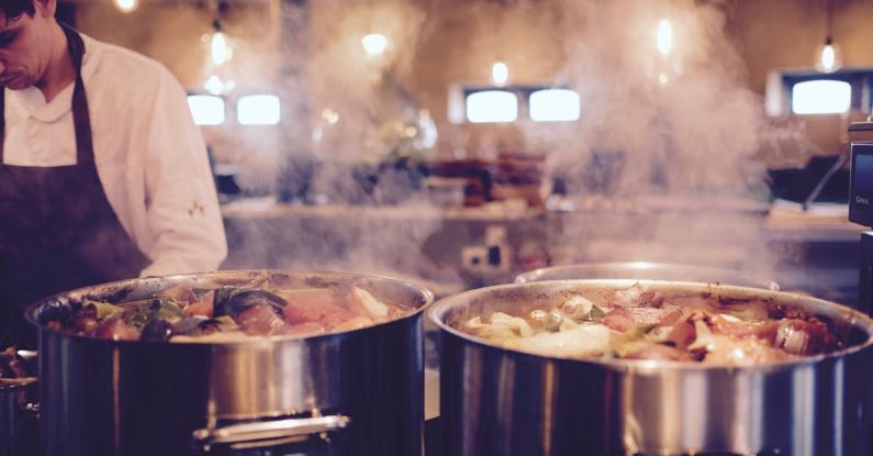 Slow Cooker - Man Wearing Black Apron Near Two Silver Metal Cooking Pot